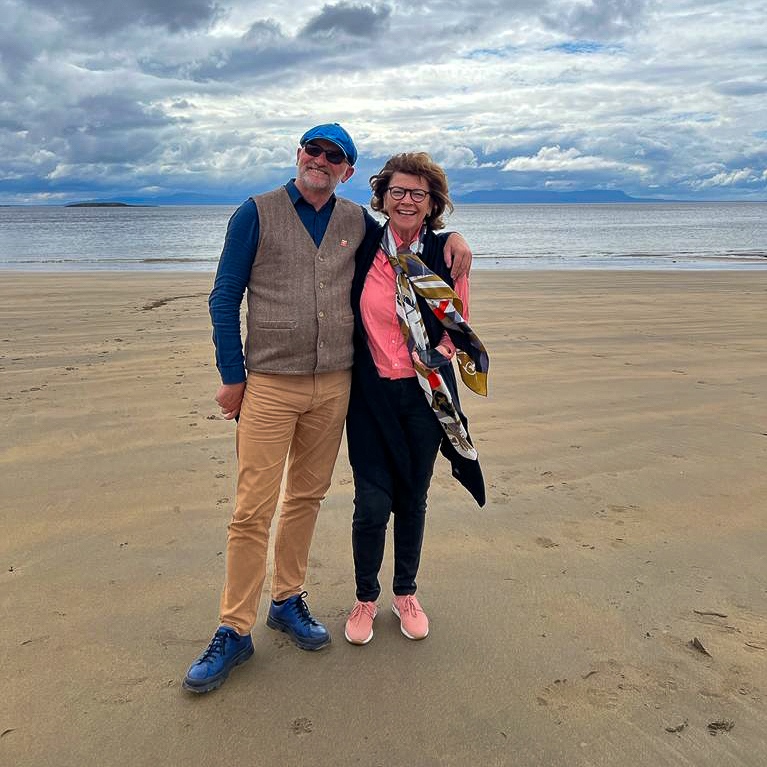 Jim Dempsey with a guest on an Irish beach.